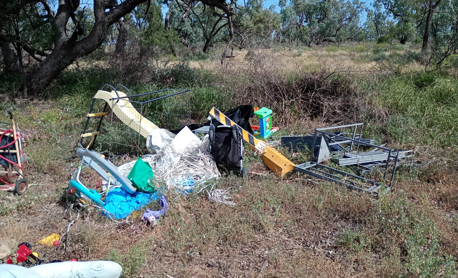 Bulk waste dumped on a side road north of Yarraman.