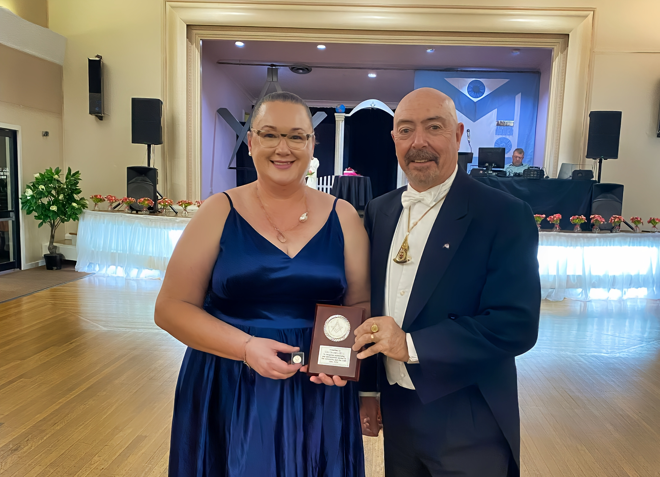 Gwanita Hill and Grand Master Les Hicks, with her Distinguished Service to the Community Award (image courtesy of Kym Skinner).