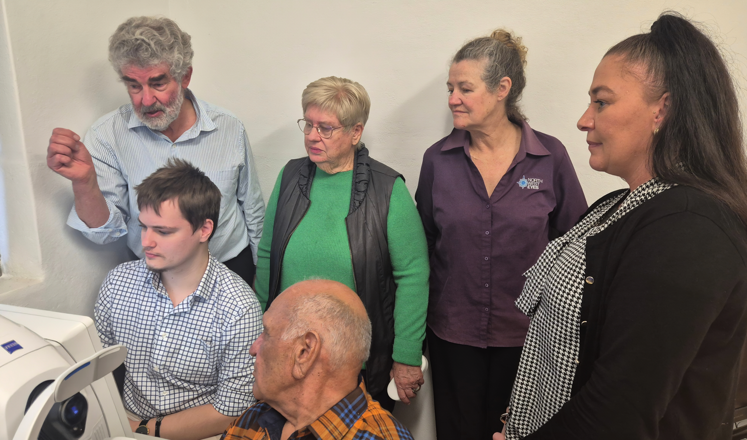(at back) Ophthalmologist, Dr David Moore, United Hospital Auxiliary president Anne Madden, nurse Fiona Peters and receptionist Sonya Clayton with (at front) ophthalmic technician Daniel Penrose and patient Terry Duncan, with the $80,000 OCT machine purchased with money raised by Moree Hospital kiosk volunteers and donations from Young Aggies and Moree Men’s Shed.